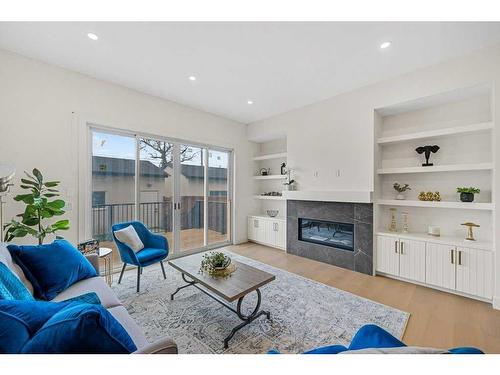 1410 43 Street Sw, Calgary, AB - Indoor Photo Showing Living Room With Fireplace