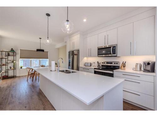 843 Carrington Boulevard Nw, Calgary, AB - Indoor Photo Showing Kitchen With Stainless Steel Kitchen With Double Sink With Upgraded Kitchen