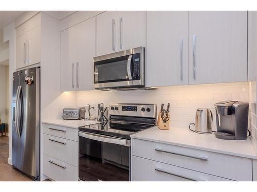 843 Carrington Boulevard Nw, Calgary, AB - Indoor Photo Showing Kitchen With Stainless Steel Kitchen With Upgraded Kitchen