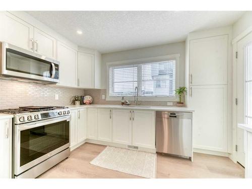 601-474 Seton Circle Se, Calgary, AB - Indoor Photo Showing Kitchen With Stainless Steel Kitchen With Upgraded Kitchen