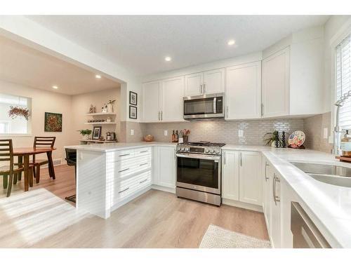 601-474 Seton Circle Se, Calgary, AB - Indoor Photo Showing Kitchen With Double Sink With Upgraded Kitchen