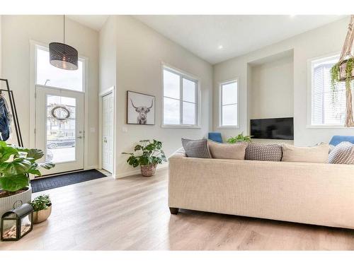 601-474 Seton Circle Se, Calgary, AB - Indoor Photo Showing Living Room With Fireplace