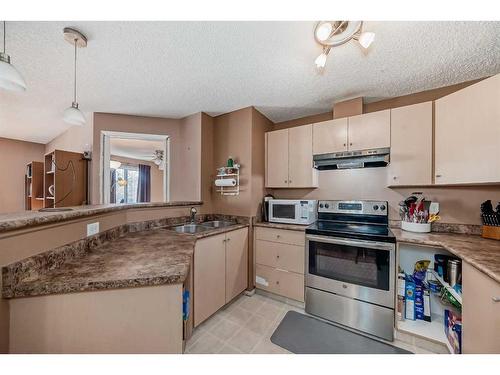 2314-16320 24 Street, Calgary, AB - Indoor Photo Showing Kitchen With Double Sink