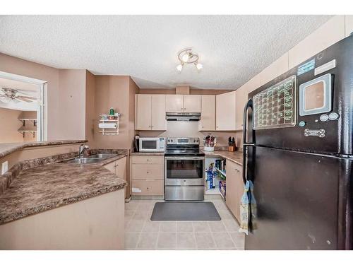 2314-16320 24 Street, Calgary, AB - Indoor Photo Showing Kitchen With Double Sink