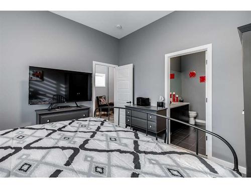 476 Reynolds Avenue Sw, Airdrie, AB - Indoor Photo Showing Bedroom