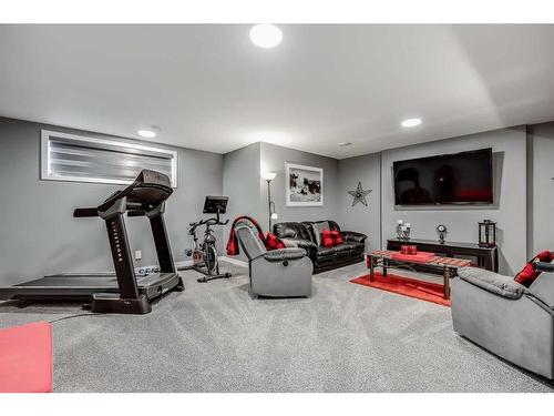 476 Reynolds Avenue Sw, Airdrie, AB - Indoor Photo Showing Gym Room