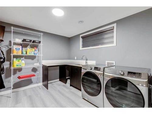 476 Reynolds Avenue Sw, Airdrie, AB - Indoor Photo Showing Laundry Room