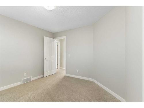 8 Sunset Close, Cochrane, AB - Indoor Photo Showing Other Room