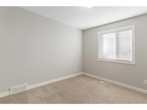 8 Sunset Close, Cochrane, AB - Indoor Photo Showing Other Room