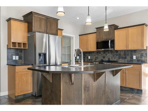 8 Sunset Close, Cochrane, AB - Indoor Photo Showing Kitchen With Double Sink