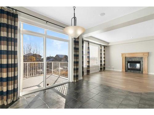 8 Sunset Close, Cochrane, AB - Indoor With Fireplace