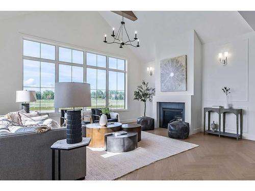 210028 Spruce Ridge West, Rural Foothills County, AB - Indoor Photo Showing Living Room With Fireplace