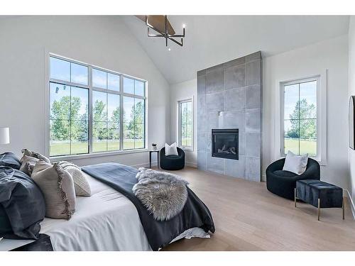 210028 Spruce Ridge West, Rural Foothills County, AB - Indoor Photo Showing Other Room With Fireplace