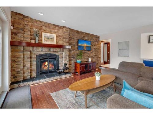 34 Sun Harbour Way Se, Calgary, AB - Indoor Photo Showing Living Room With Fireplace