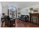 34 Sun Harbour Way Se, Calgary, AB  - Indoor Photo Showing Living Room With Fireplace 