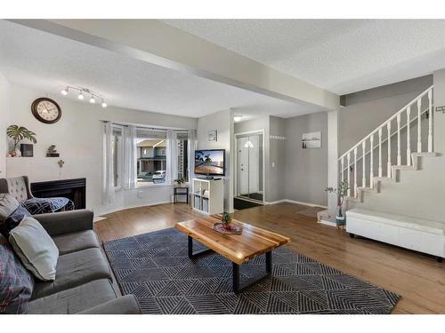 149 Patina Park Sw, Calgary, AB - Indoor Photo Showing Living Room