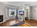 149 Patina Park Sw, Calgary, AB  - Indoor Photo Showing Living Room With Fireplace 