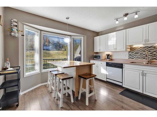 149 Patina Park Sw, Calgary, AB - Indoor Photo Showing Kitchen With Double Sink