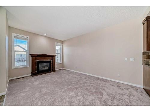 74 Brightoncrest Grove Se, Calgary, AB - Indoor Photo Showing Living Room With Fireplace