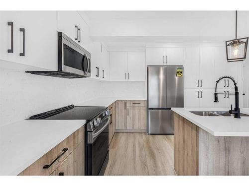 11113 Hidden Valley Drive Nw, Calgary, AB - Indoor Photo Showing Kitchen With Double Sink With Upgraded Kitchen