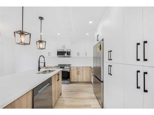 11113 Hidden Valley Drive Nw, Calgary, AB - Indoor Photo Showing Kitchen With Double Sink With Upgraded Kitchen