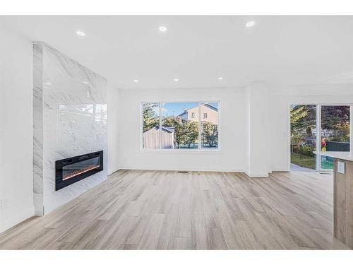 11113 Hidden Valley Drive Nw, Calgary, AB - Indoor Photo Showing Living Room With Fireplace