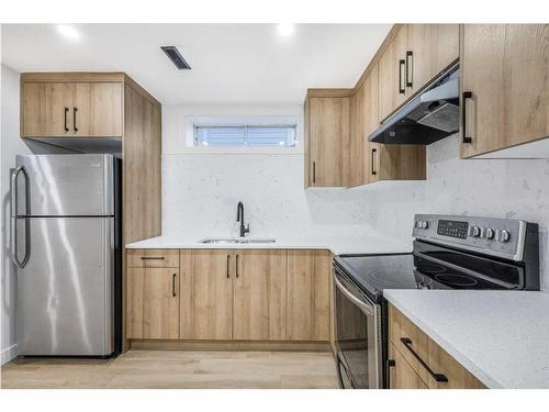 11113 Hidden Valley Drive Nw, Calgary, AB - Indoor Photo Showing Kitchen With Double Sink