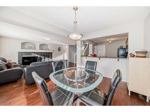 316 Panora Close Nw, Calgary, AB - Indoor Photo Showing Dining Room With Fireplace