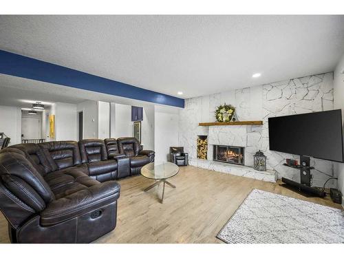 636 West Chestermere Drive, Chestermere, AB - Indoor Photo Showing Living Room With Fireplace