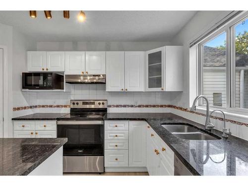 319 Sierra Nevada Place Sw, Calgary, AB - Indoor Photo Showing Kitchen With Double Sink