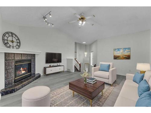 319 Sierra Nevada Place Sw, Calgary, AB - Indoor Photo Showing Living Room With Fireplace