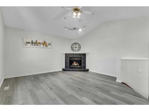 319 Sierra Nevada Place Sw, Calgary, AB - Indoor Photo Showing Living Room With Fireplace