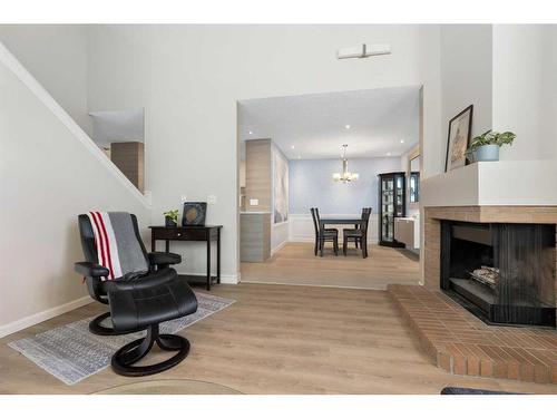 84 Woodmeadow Close Sw, Calgary, AB - Indoor With Fireplace