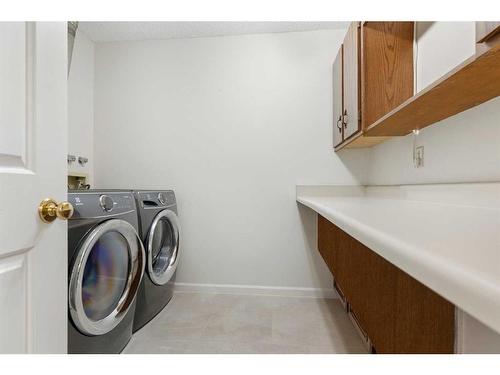 84 Woodmeadow Close Sw, Calgary, AB - Indoor Photo Showing Laundry Room