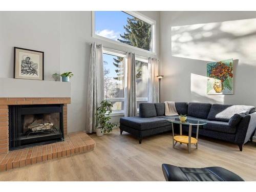 84 Woodmeadow Close Sw, Calgary, AB - Indoor Photo Showing Living Room With Fireplace