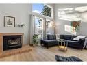 84 Woodmeadow Close Sw, Calgary, AB  - Indoor Photo Showing Living Room With Fireplace 