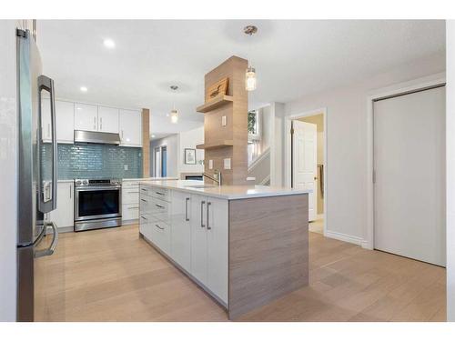 84 Woodmeadow Close Sw, Calgary, AB - Indoor Photo Showing Kitchen With Upgraded Kitchen