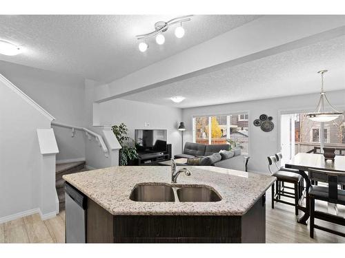 345 Hillcrest Square Sw, Airdrie, AB - Indoor Photo Showing Kitchen With Double Sink