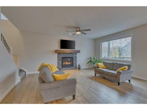 99 Legacy Glen Terrace Se, Calgary, AB - Indoor Photo Showing Living Room With Fireplace