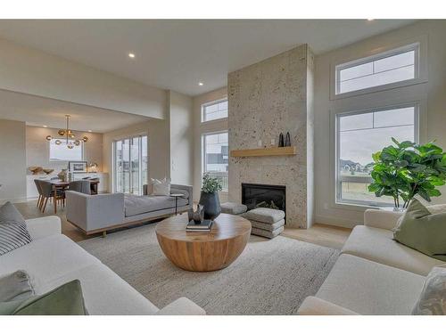 703 Green Haven Place, Rural Foothills County, AB - Indoor Photo Showing Living Room With Fireplace