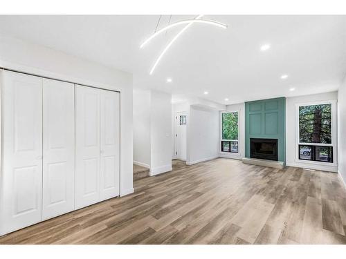 6740 Temple Drive Ne, Calgary, AB - Indoor Photo Showing Living Room With Fireplace