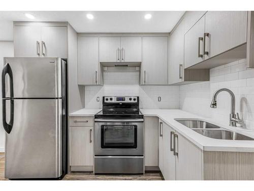 6740 Temple Drive Ne, Calgary, AB - Indoor Photo Showing Kitchen With Double Sink With Upgraded Kitchen