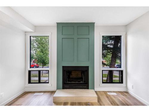 6740 Temple Drive Ne, Calgary, AB - Indoor Photo Showing Living Room With Fireplace