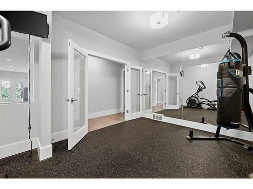 80 Coulee Way Sw, Calgary, AB - Indoor Photo Showing Gym Room