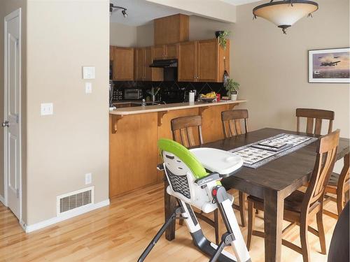 1105-720 Willowbrook Road Nw, Airdrie, AB - Indoor Photo Showing Dining Room