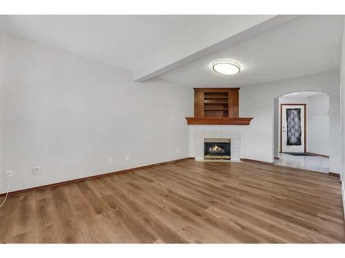 183 Coral Spings Circle Ne, Calgary, AB - Indoor With Fireplace