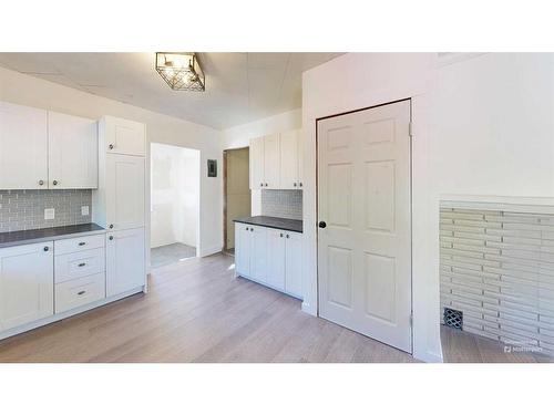 2313 22 Street, Nanton, AB - Indoor Photo Showing Kitchen