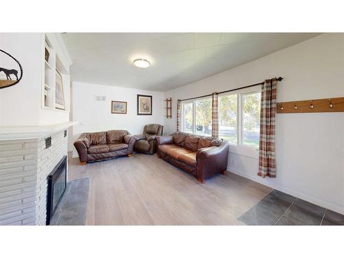 2313 22 Street, Nanton, AB - Indoor Photo Showing Other Room With Fireplace