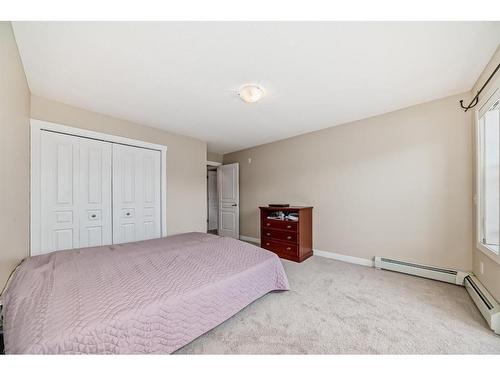 2214-211 Aspen Stone Boulevard Sw, Calgary, AB - Indoor Photo Showing Bedroom