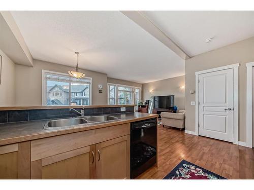 2214-211 Aspen Stone Boulevard Sw, Calgary, AB - Indoor Photo Showing Kitchen With Double Sink